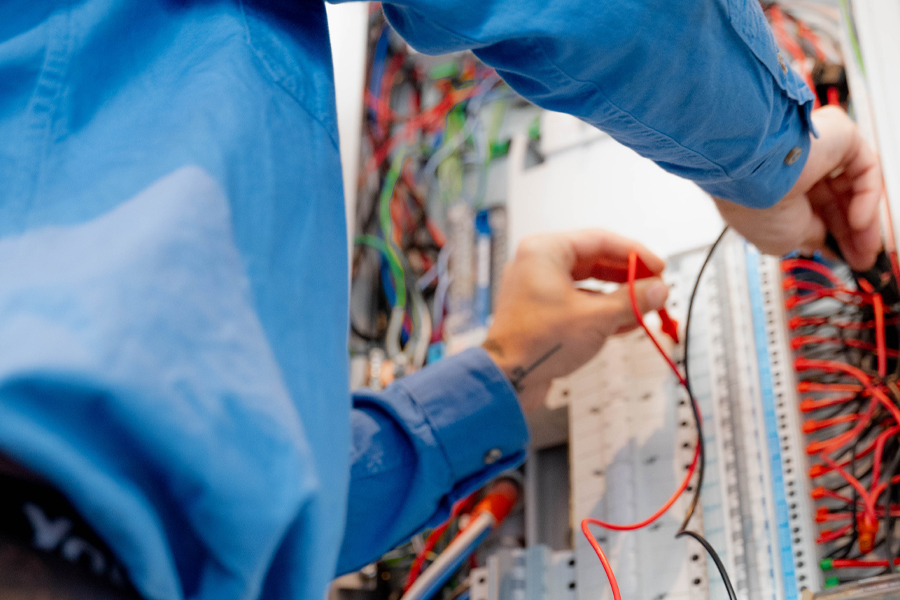 Electrician working on switchboard