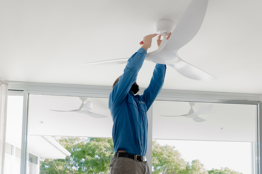 Electrician working on a ceiling fan