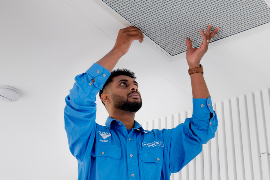 Electrician replaces AC vent